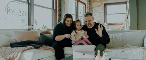 Family waving at laptop