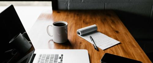 Desk with notes and coffee - photo: Andrew Neel