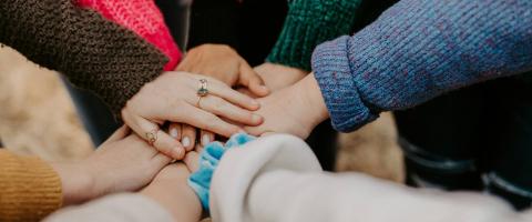 Hands together - photo: Hannah Busing